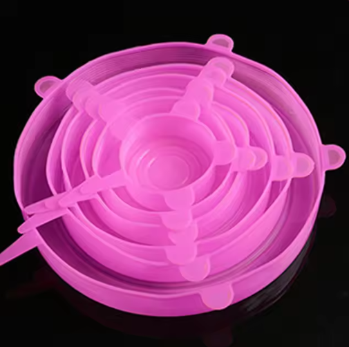 Pink silicone lid on a black background