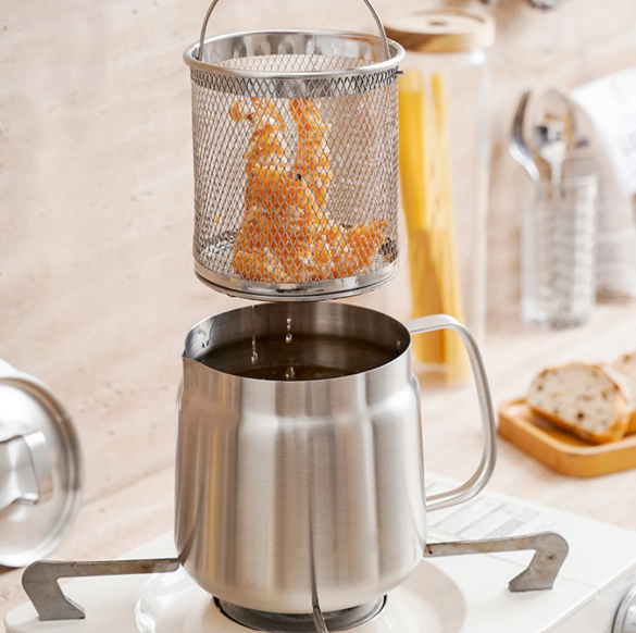 Stainless Oil Pot Strainer with mesh basket on a kitchen counter